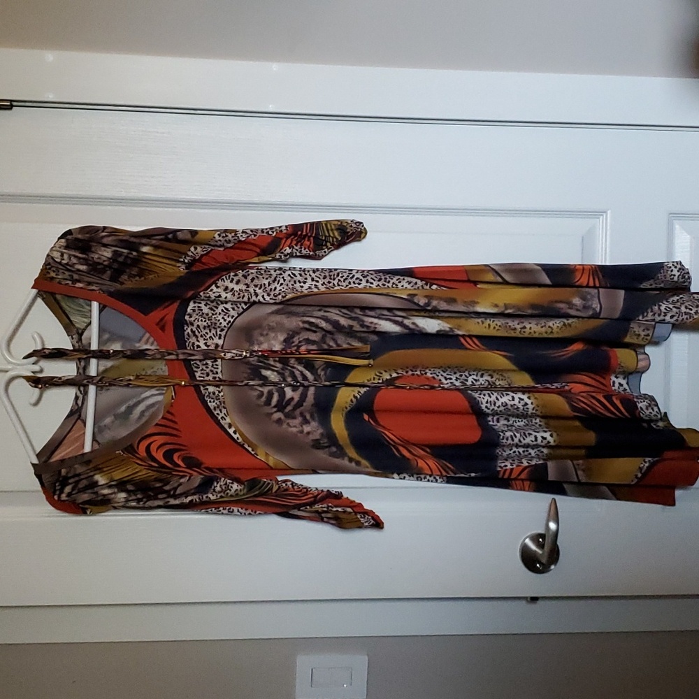 Maxime Paris made dress. Multi colored with attractive sleeves and hem.